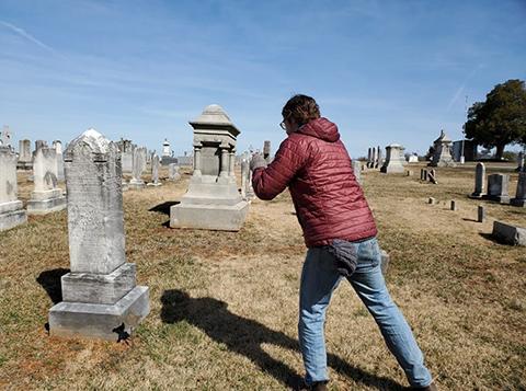 Man mapping a cemetery using mobile app